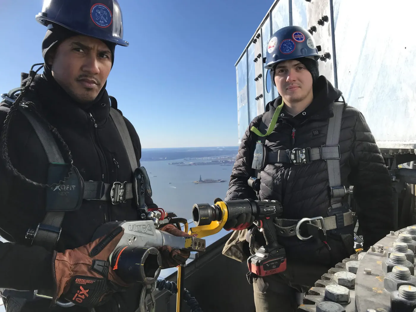 Workers atop One World Trade Center using TorcUP hydraulic torque wrenches